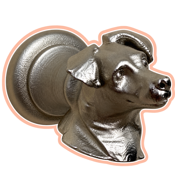 Silver dog-head cabinet knob with peach sticker outline