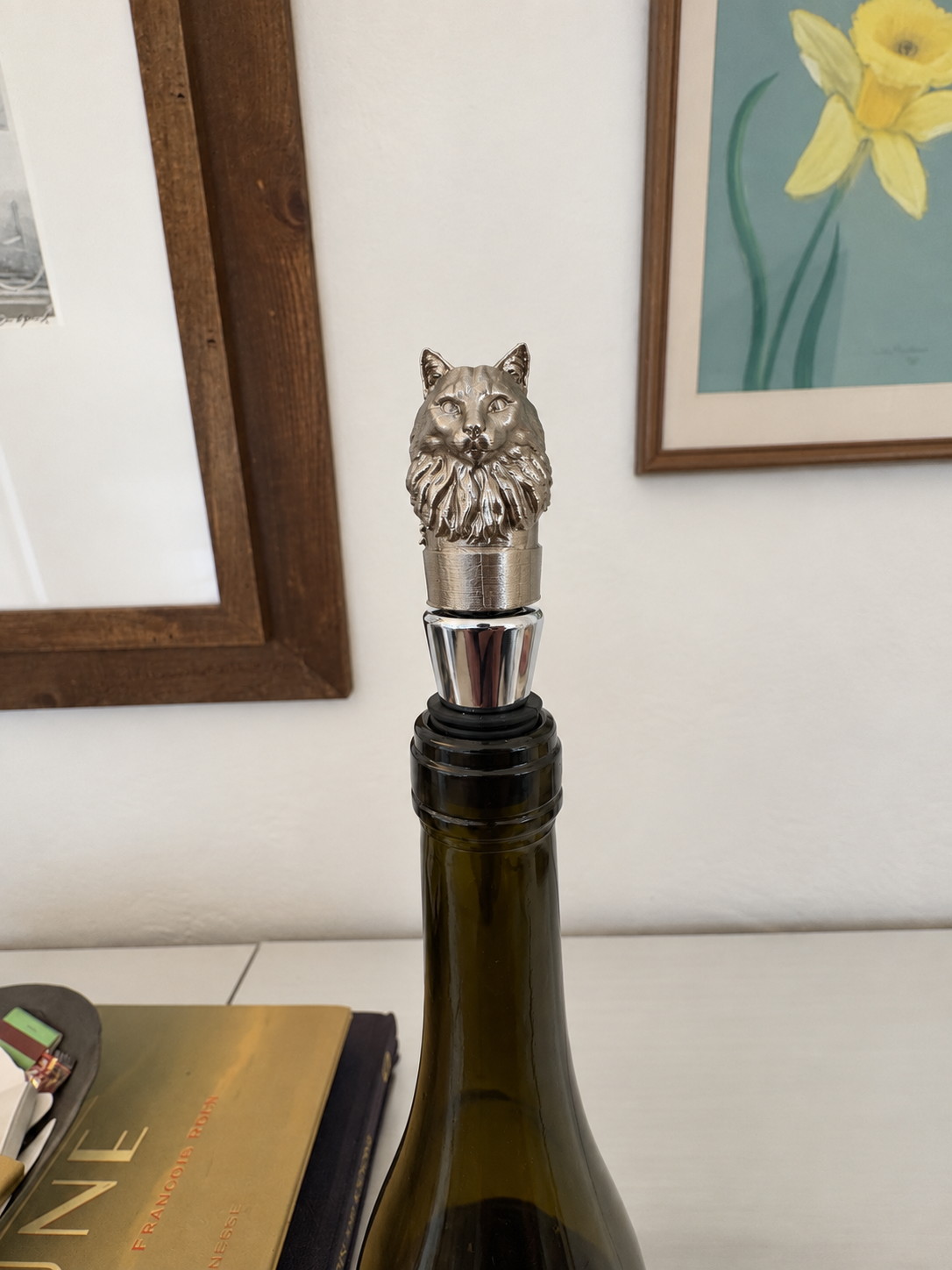 Cat wine stopper fitted into a wine bottle